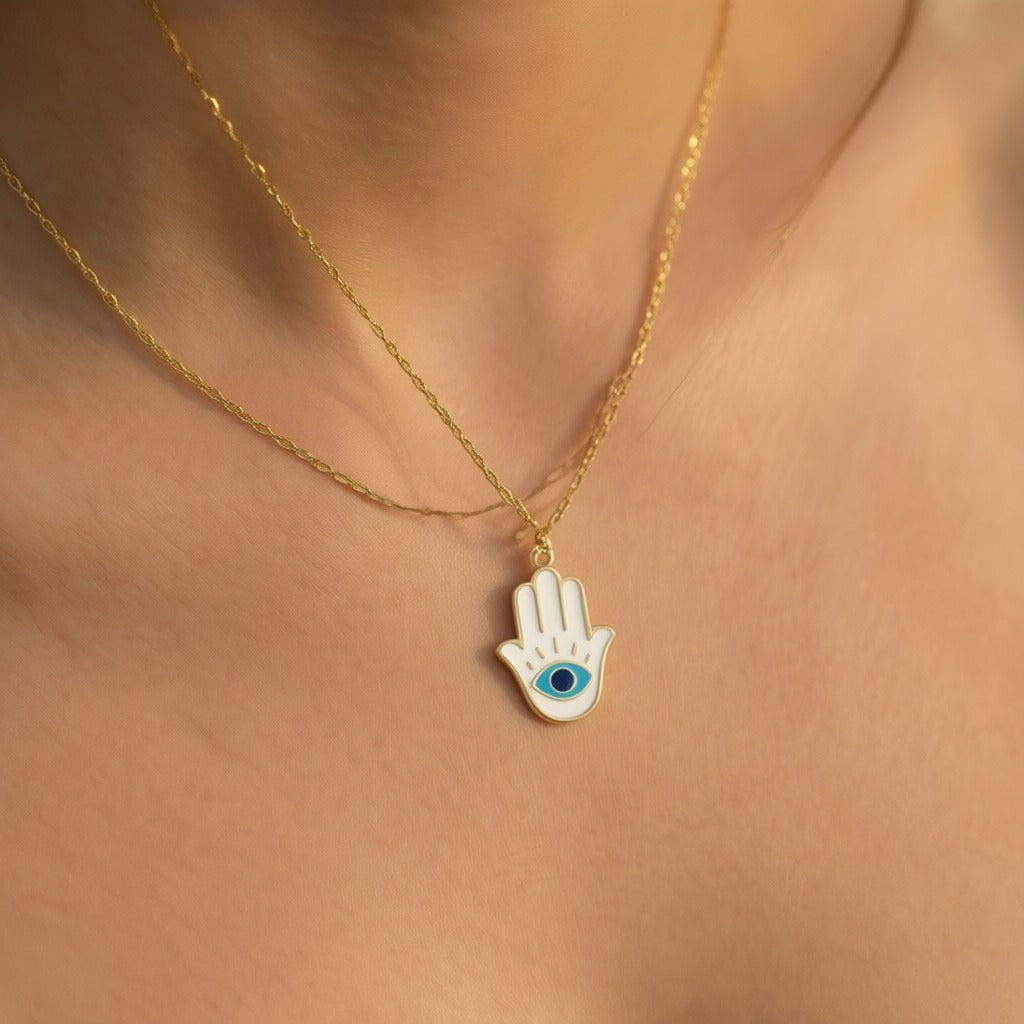 Hamsa pendant in white gold with navy enamel detail by Alef Bet