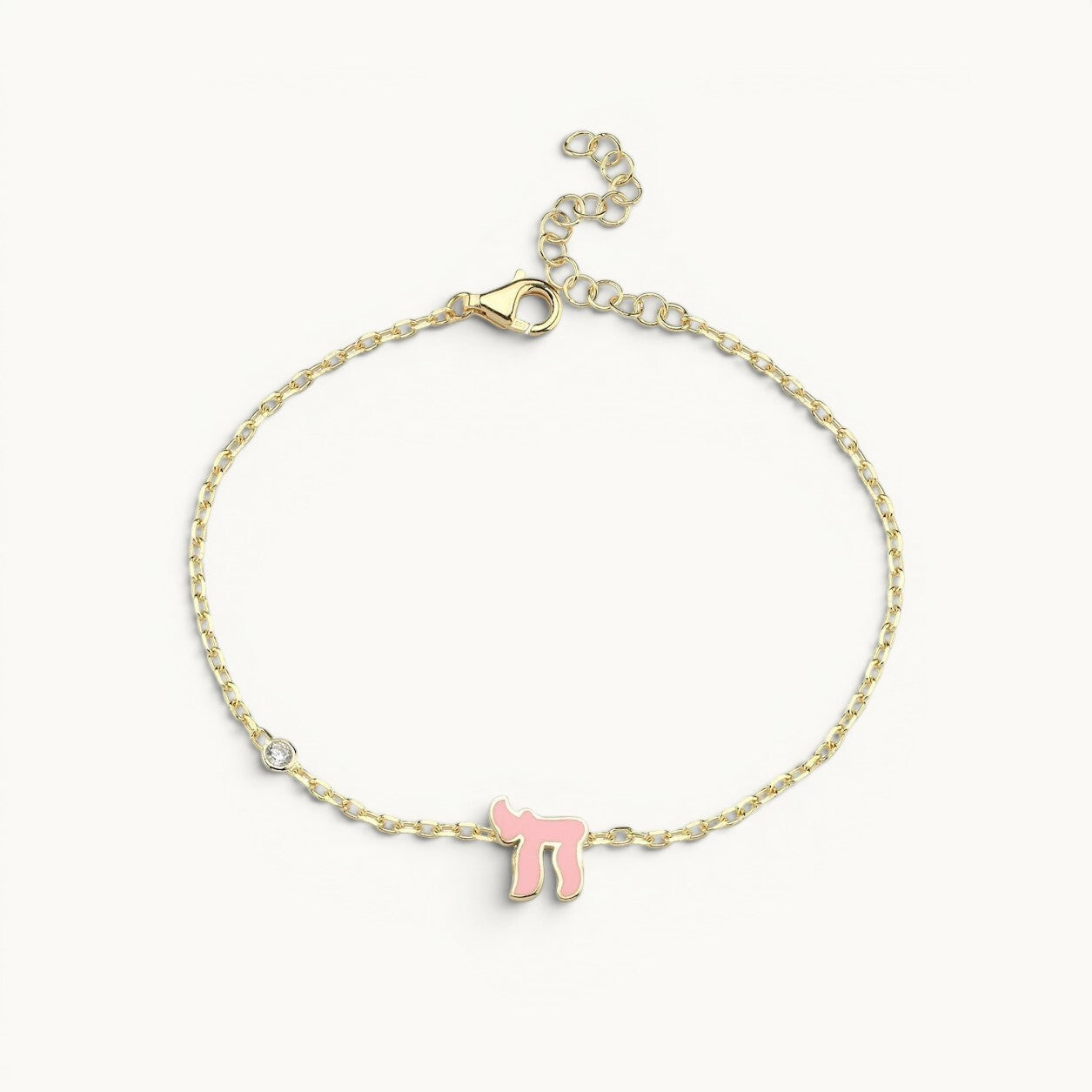 Sterling silver or 14k gold plated Hebrew Chai bracelet with sparkling pink or blue cubic zircon gemstone, celebrating life.