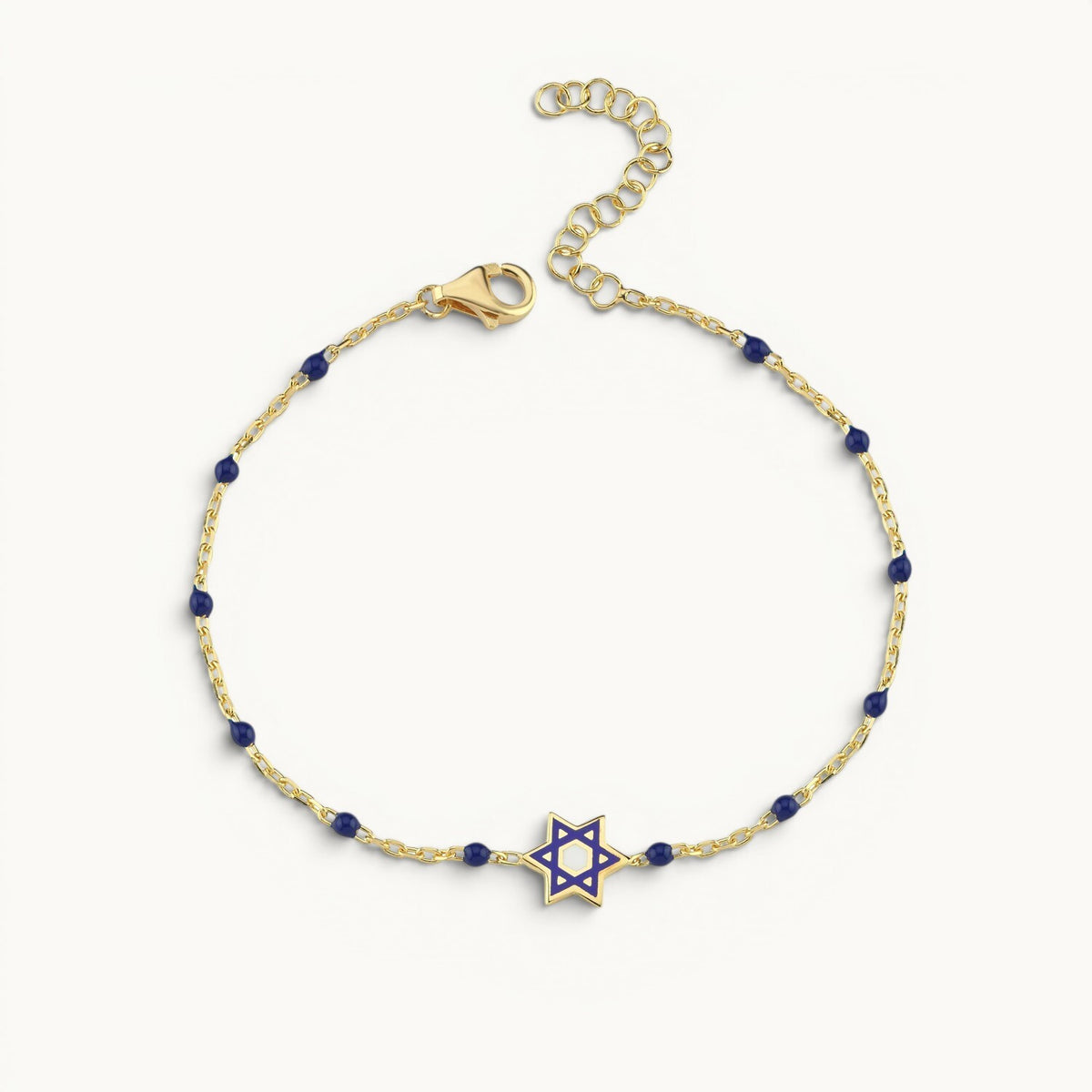 Sterling silver bracelet with yellow gold plating featuring enamel Jewish star bead by Alef Bet