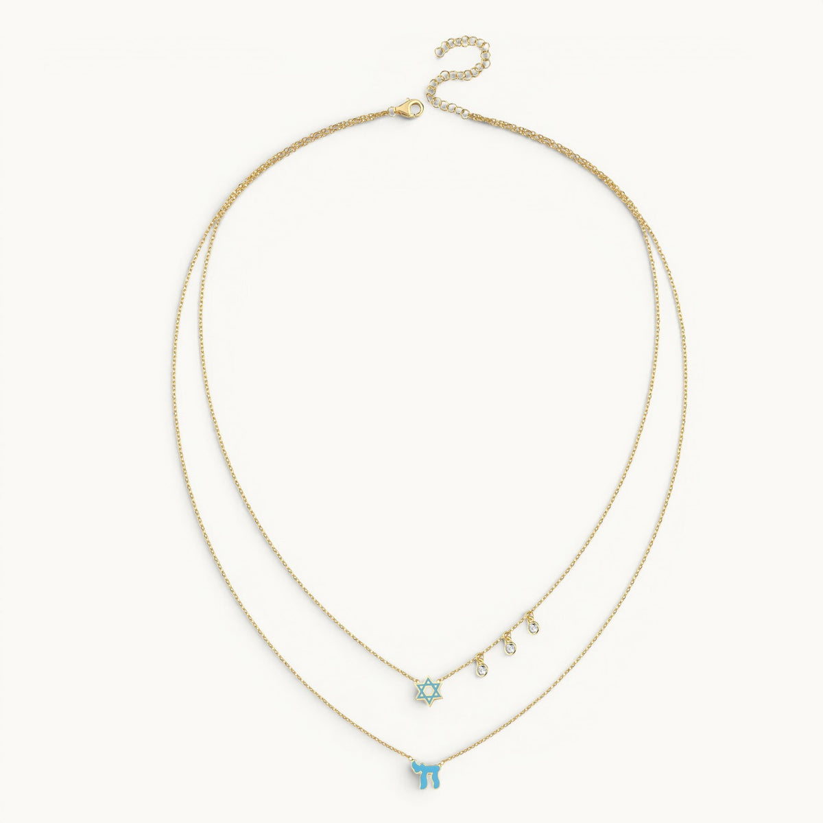 Layered necklace in gold with pink enamel Chai and Star of David charms by Alef Bet