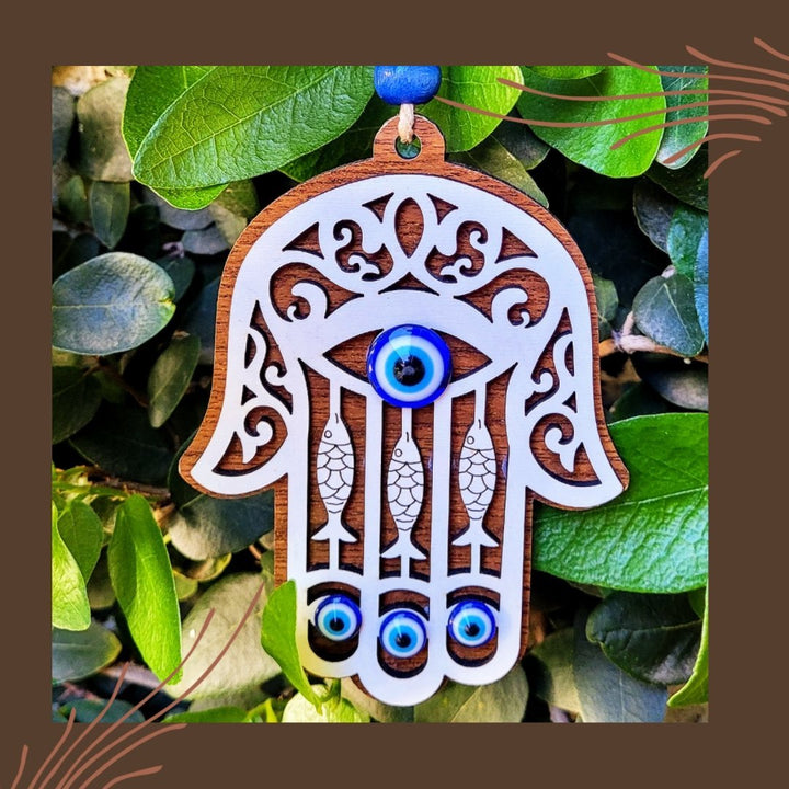 Handmade wood amulet with evil eye and hamsa hand for guidance and protection