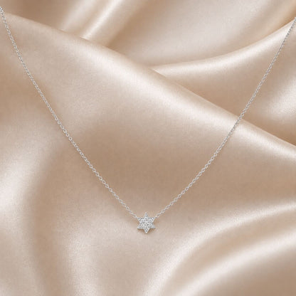 Star of David pendant in yellow gold with diamond pave setting, overhead view by Alef Bet