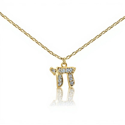 Chai pendant in yellow gold with pave-set cubic zirconia stones by Alef Bet