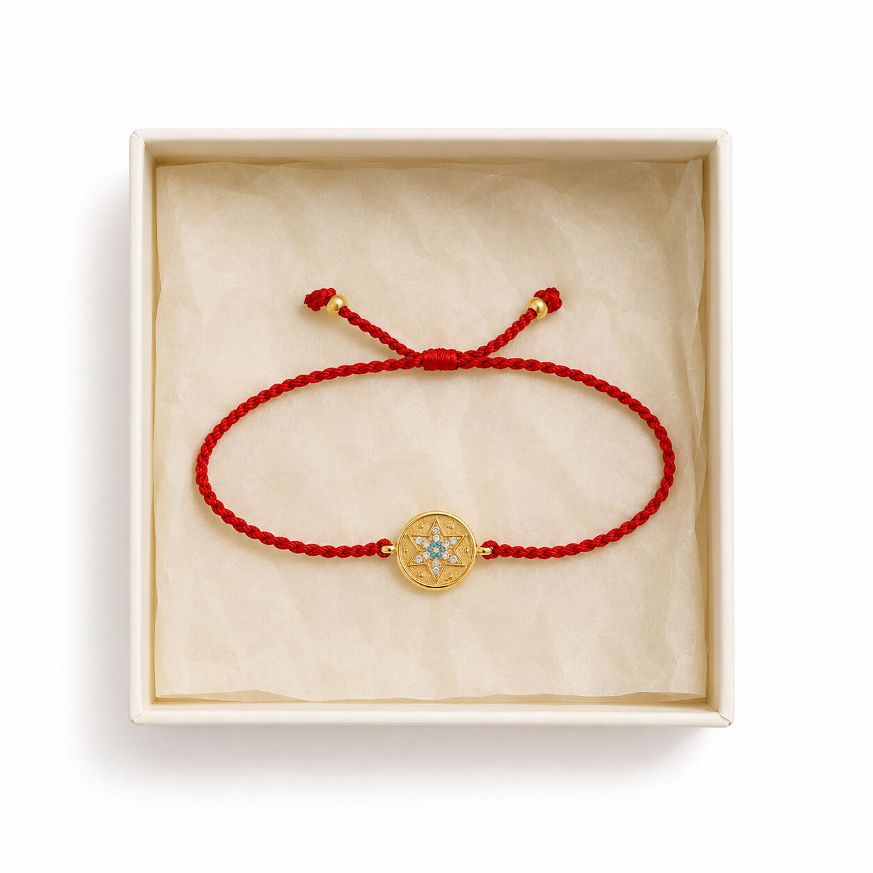 Red string bracelet with adjustable silver star accent shown from side angle by Alef Bet