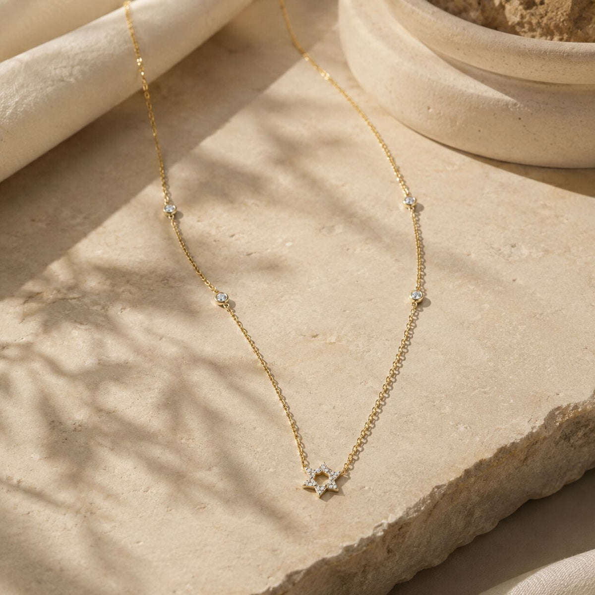 Diamond bezel Jewish star pendant necklace featuring pave-set accent diamonds by Alef Bet