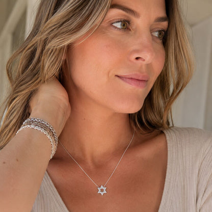 Sterling silver Star of David necklace featuring pave CZ stones and pierced star detail by Alef Bet