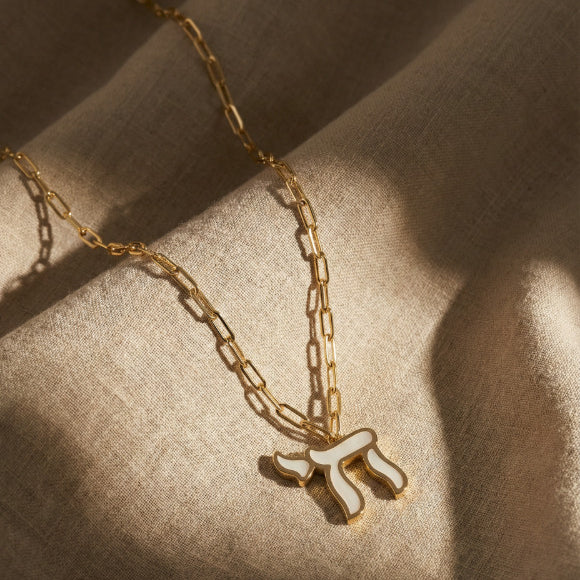 Colorful enamel chai necklace featuring paperclip chain in yellow gold plated finish by Alef Bet