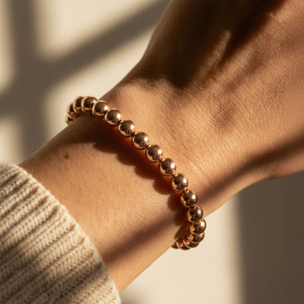 Rose gold 6mm beaded bracelet showcasing round bead detail by Alef Bet