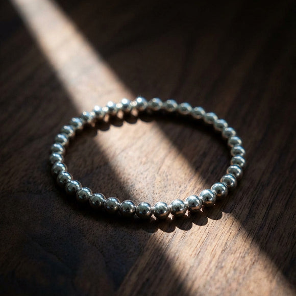Sterling silver 6mm bead bracelet worn angle showing comfortable fit by Alef Bet