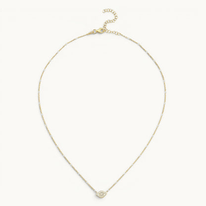 Evil eye pendant in yellow gold with white enamel and pave diamond accents by Alef Bet