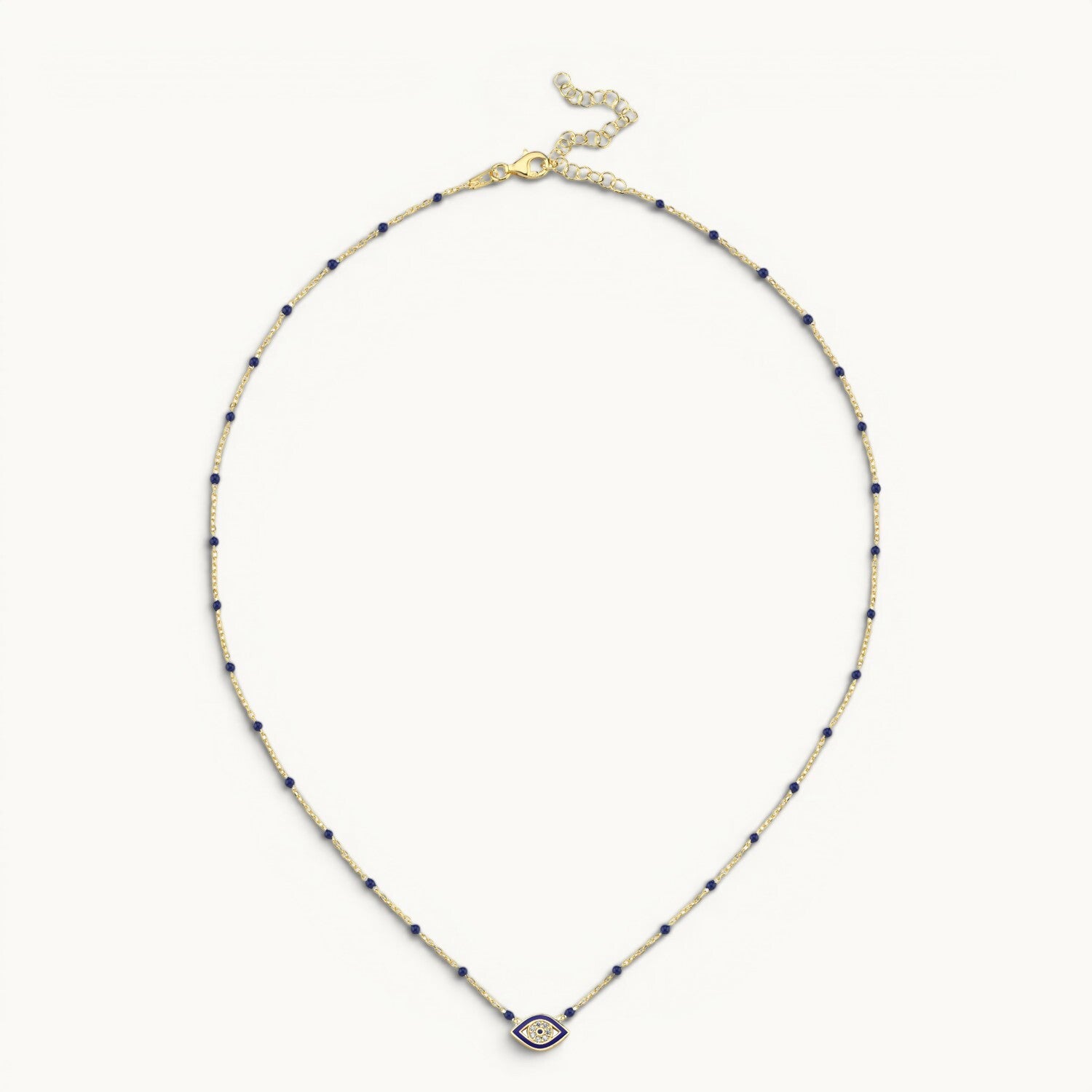 Evil eye pendant in yellow gold with navy enamel by Alef Bet