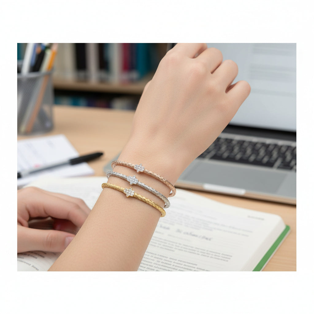 Silver hamsa bangle bracelet with satin finish and dimensional hand charm by Alef Bet