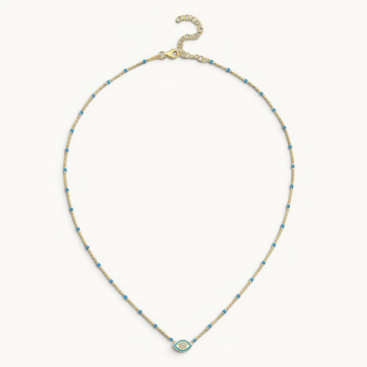 Enamel evil eye pendant in light blue with yellow gold plating by Alef Bet