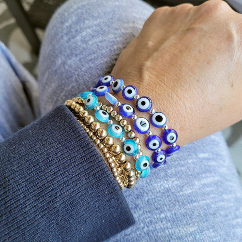 Navy evil eye bracelet featuring round enamel eye charm by Alef Bet