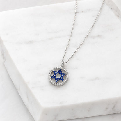 Sterling silver Star of David necklace with blue sapphire cubic zirconia stone and gold-plated halo setting by Alef Bet