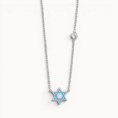 Star of David necklace in sterling silver with blue enamel and bezel-set cubic zirconia by Alef Bet