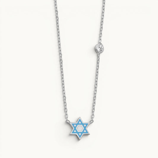Star of David necklace in sterling silver with blue enamel and bezel-set cubic zirconia by Alef Bet
