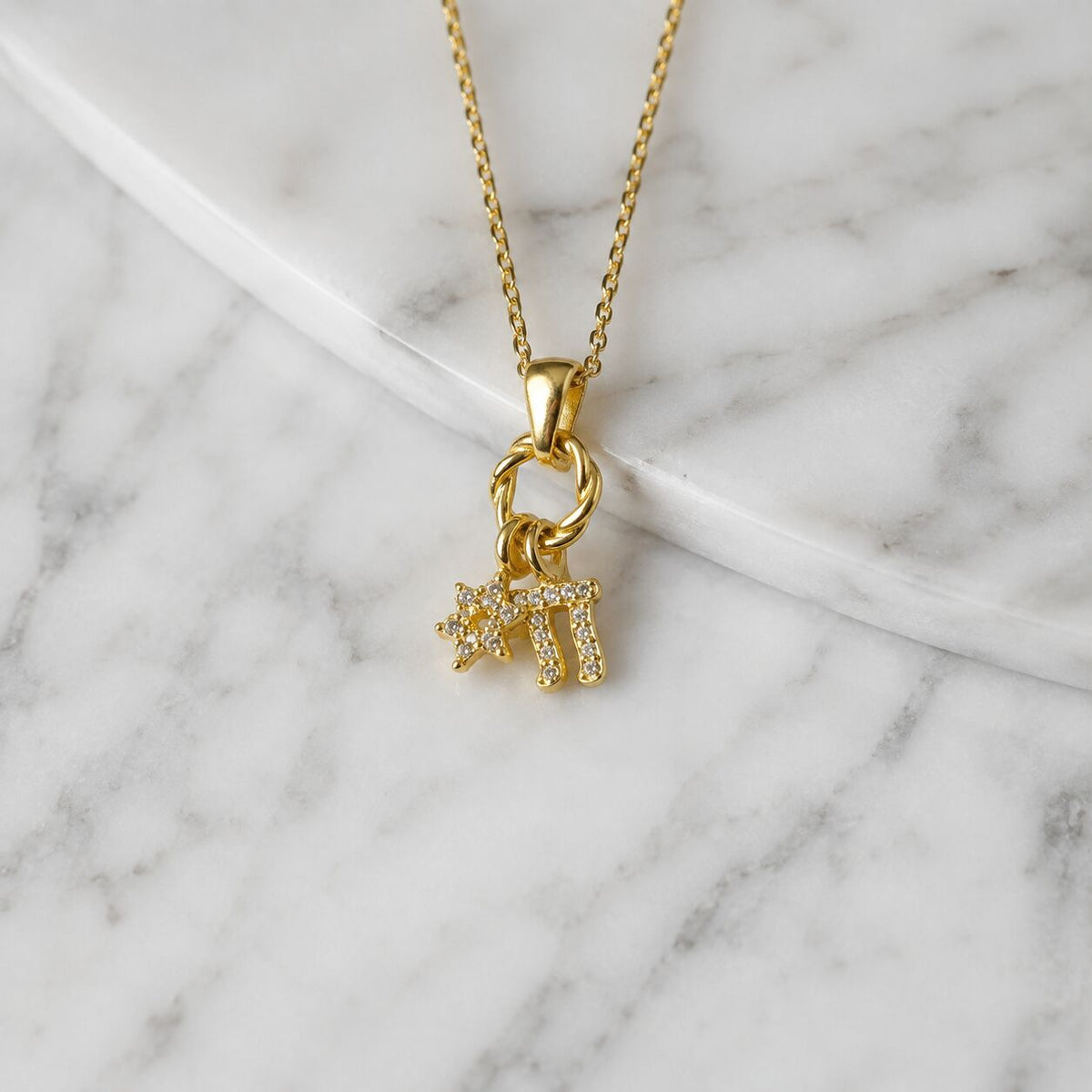 Sterling silver cluster necklace with chai symbol and Star of David pendant design