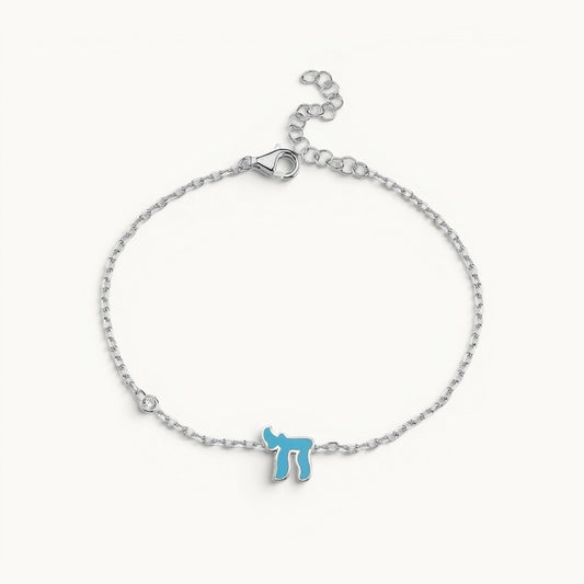 Chai Hebrew bracelet featuring sparkling pink or blue cubic zirconia, crafted in sterling silver or 14k gold plated, symbolic of life.