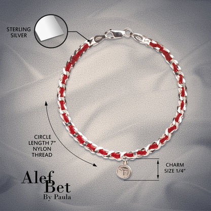 Sterling silver Chai charm on a red string bracelet symbolizing life, luck, and protection, with an informative description card included.