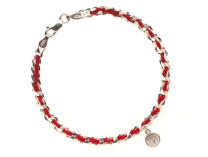 Sterling silver Chai charm on a red string bracelet symbolizes life, luck, and protection; includes a story card.