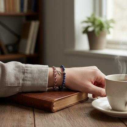 Red string protection bracelet with sterling silver Chai pendant, includes description card, ideal gift for loved ones.
