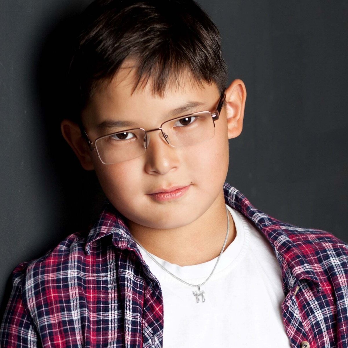 A beautiful sterling silver chai necklace featuring a box chain, perfect for bar mitzvah gifts, symbolizing health and prosperity.