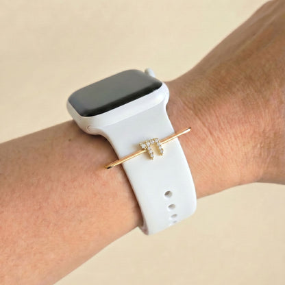 Smartwatch with a white band and gold bracelet with jewish chai charm