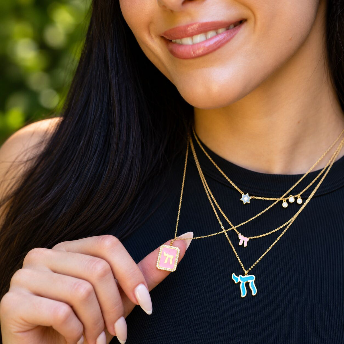 Chai pendant in yellow gold plated featuring colorful light blue enamel by Alef Bet