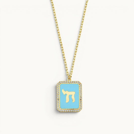 Chai necklace in yellow gold plated with light blue enamel details by Alef Bet