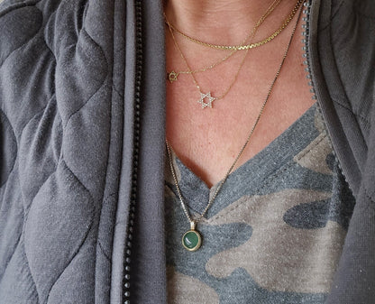 Star of David pendant in 14K white gold with bezel-set diamond by Alef Bet