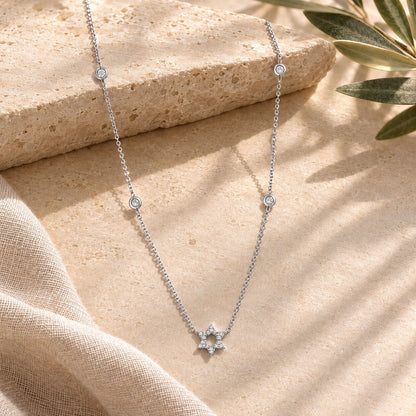 Diamond bezel Jewish star necklace in white gold with bezel-set diamond accents by Alef Bet