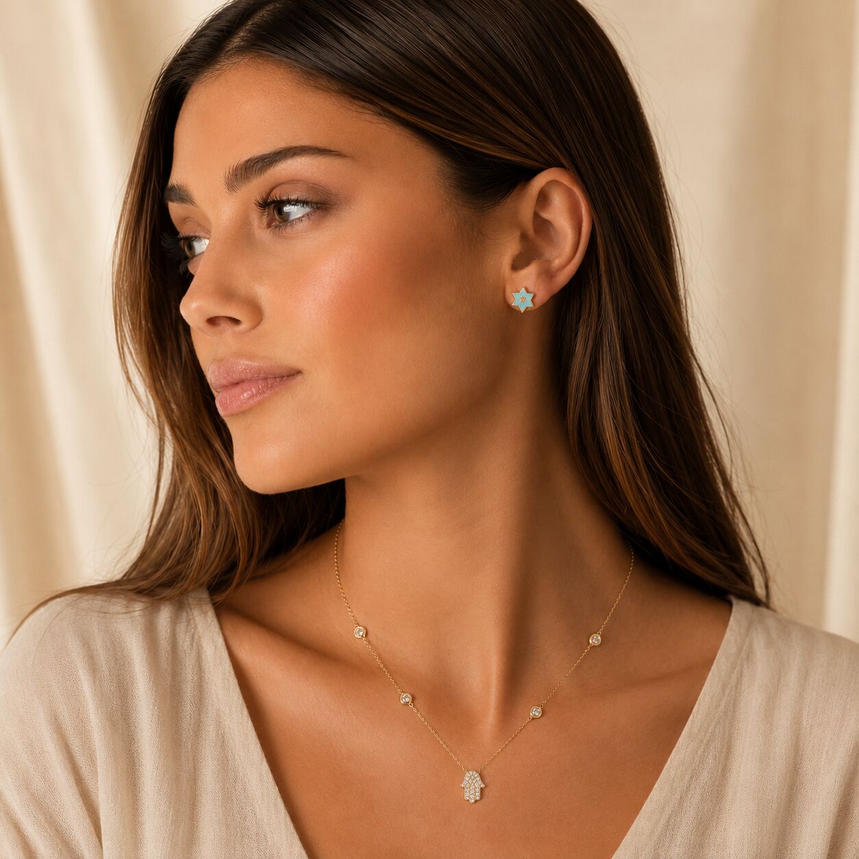 14k gold hamsa necklace featuring bezel-set diamond stations by Alef Bet