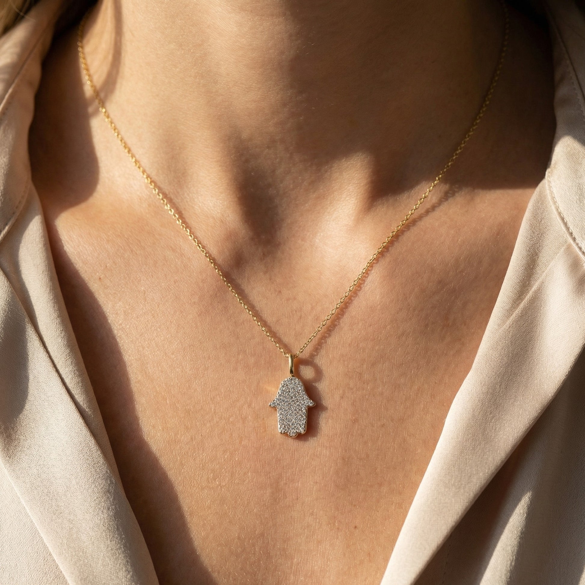 Pave diamond hamsa charm in 14k white gold on 16 inch chain by Alef Bet