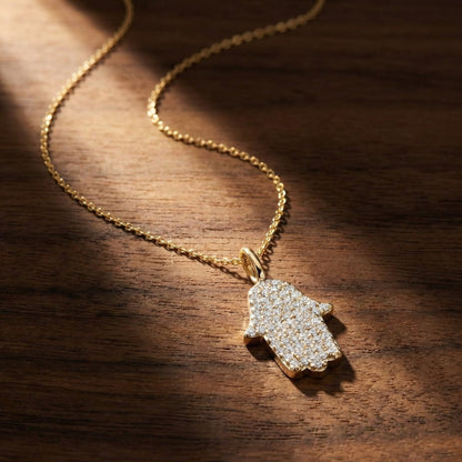 Diamond hamsa necklace in 14k white gold with intricate pave detailing by Alef Bet