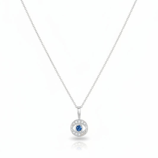 Diamond evil eye pendant in white gold with pave diamond surround and sapphire center by Alef Bet