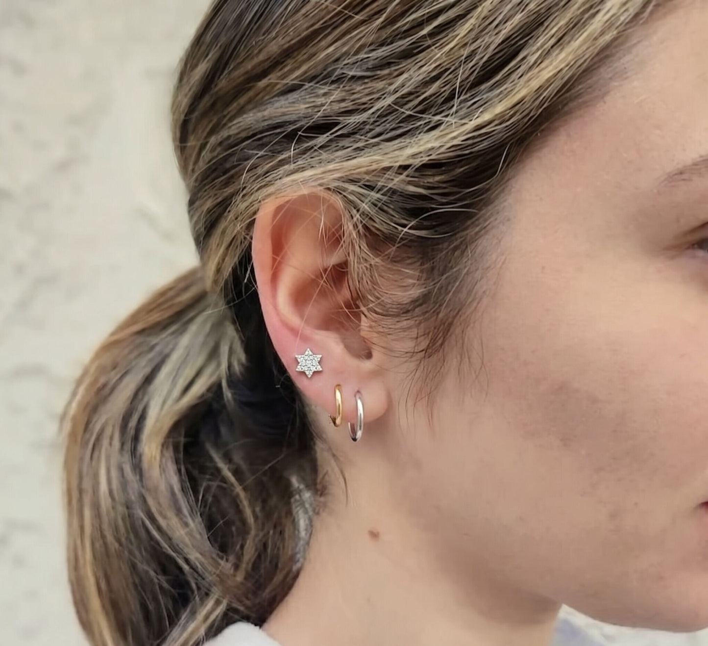 Star of David diamond stud earrings in 14k yellow gold, front view by Alef Bet