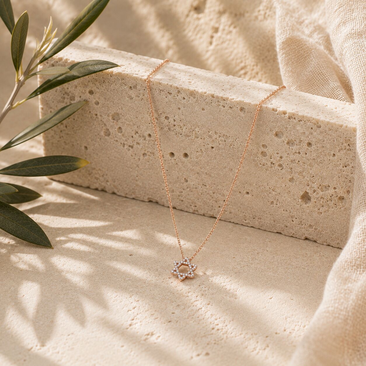 Diamond Star of David necklace in 14k gold with bezel-set stones, side angle by Alef Bet