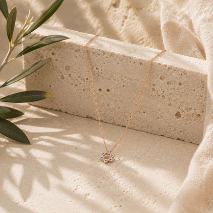 Diamond Star of David necklace in 14k gold with bezel-set stones, side angle by Alef Bet