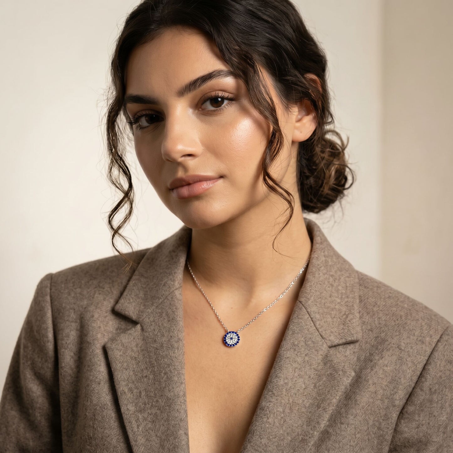A delicate evil eye necklace in sterling silver or 14k gold plate, designed to protect and add charm, ideal for everyday wear.