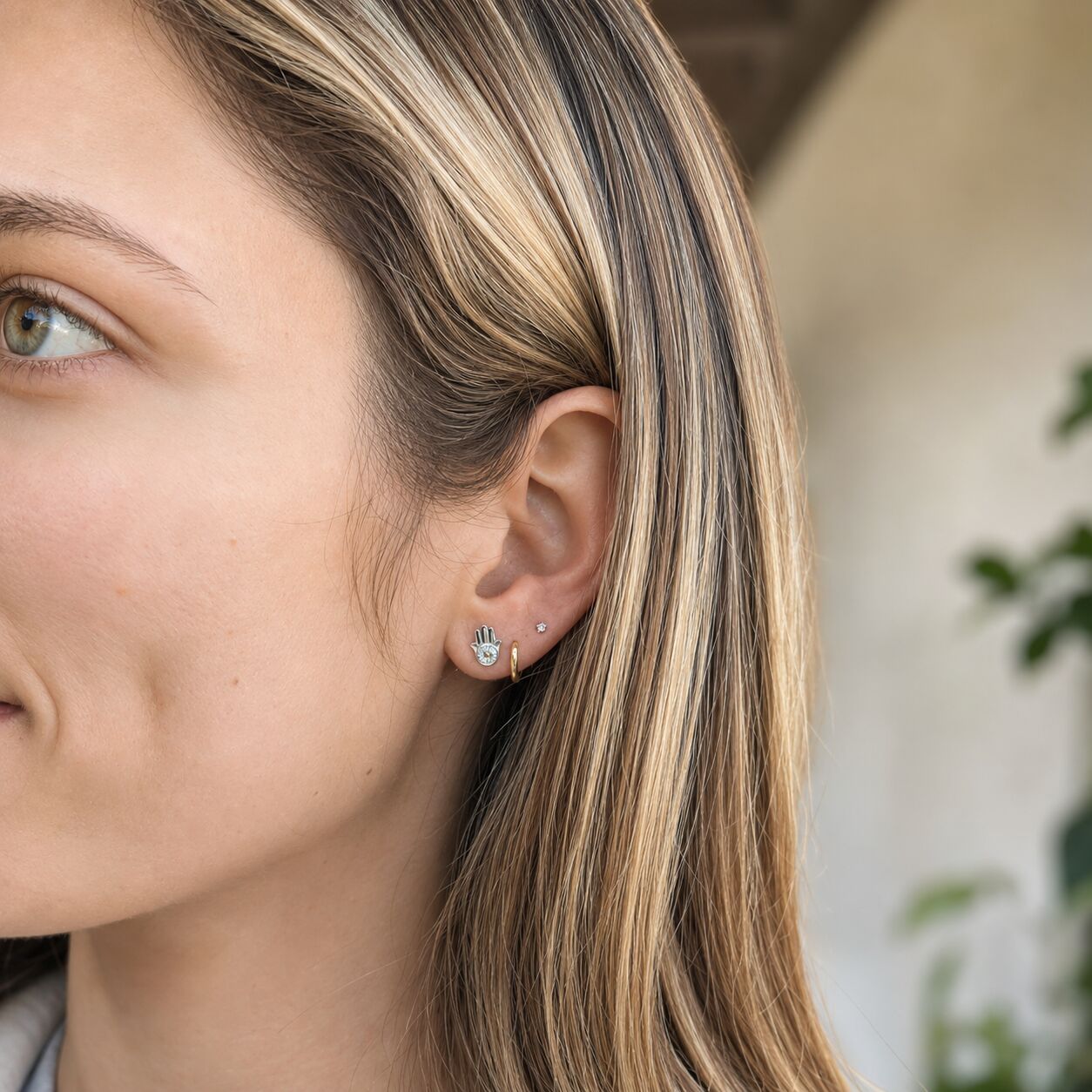 Diamond hamsa evil eye stud earrings in yellow gold with pave-set detail by Alef Bet