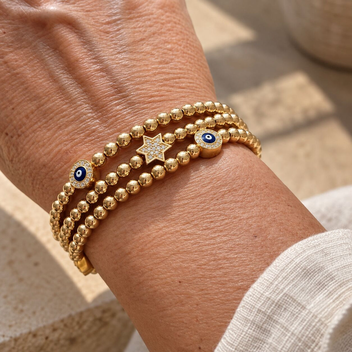 Red evil eye bead bracelet featuring 4mm beads and protective symbol by Alef Bet