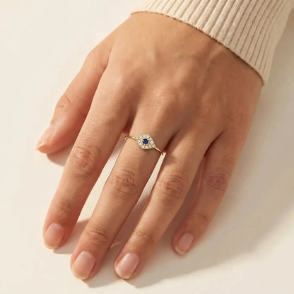 Evil eye ring in 14k gold featuring bezel-set diamond surround, side view by Alef Bet