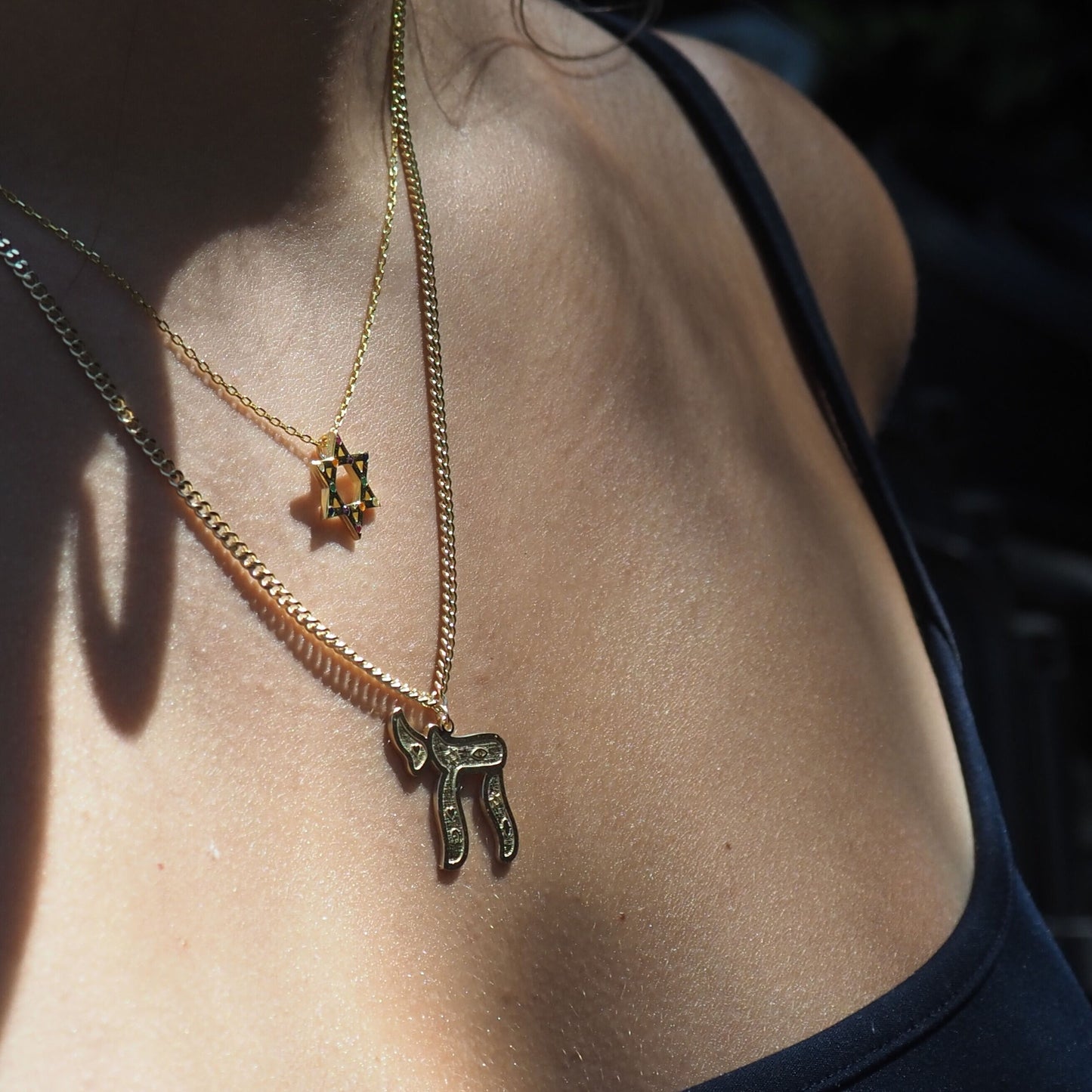 Gold plated Chai necklace showcasing intricate symbol details on substantial cable chain by Alef Bet