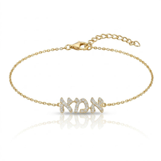 14k gold diamond Ema bracelet with pave-set stones and satin finish band by Alef Bet