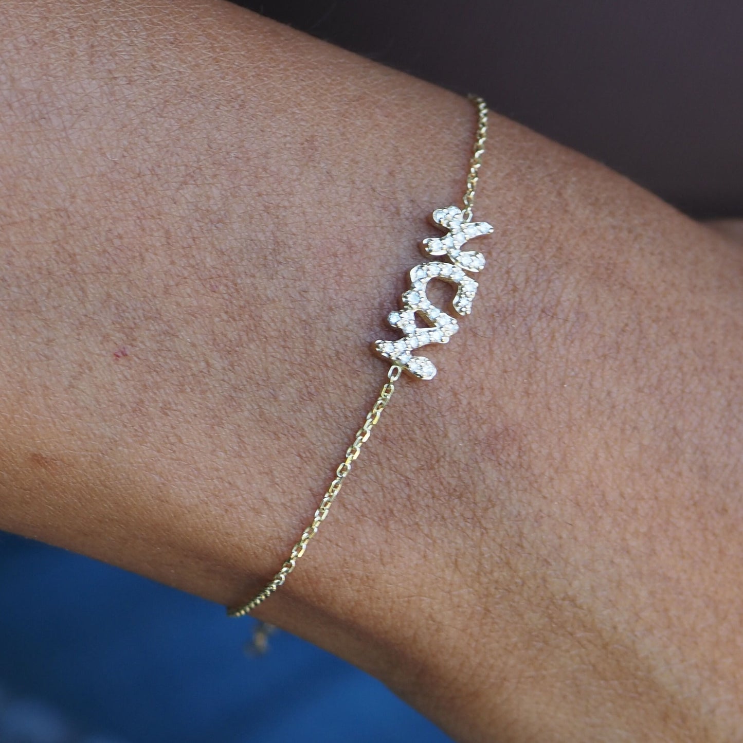 Diamond Ema bracelet in 14k gold with high-polish finish and Hebrew inscription by Alef Bet