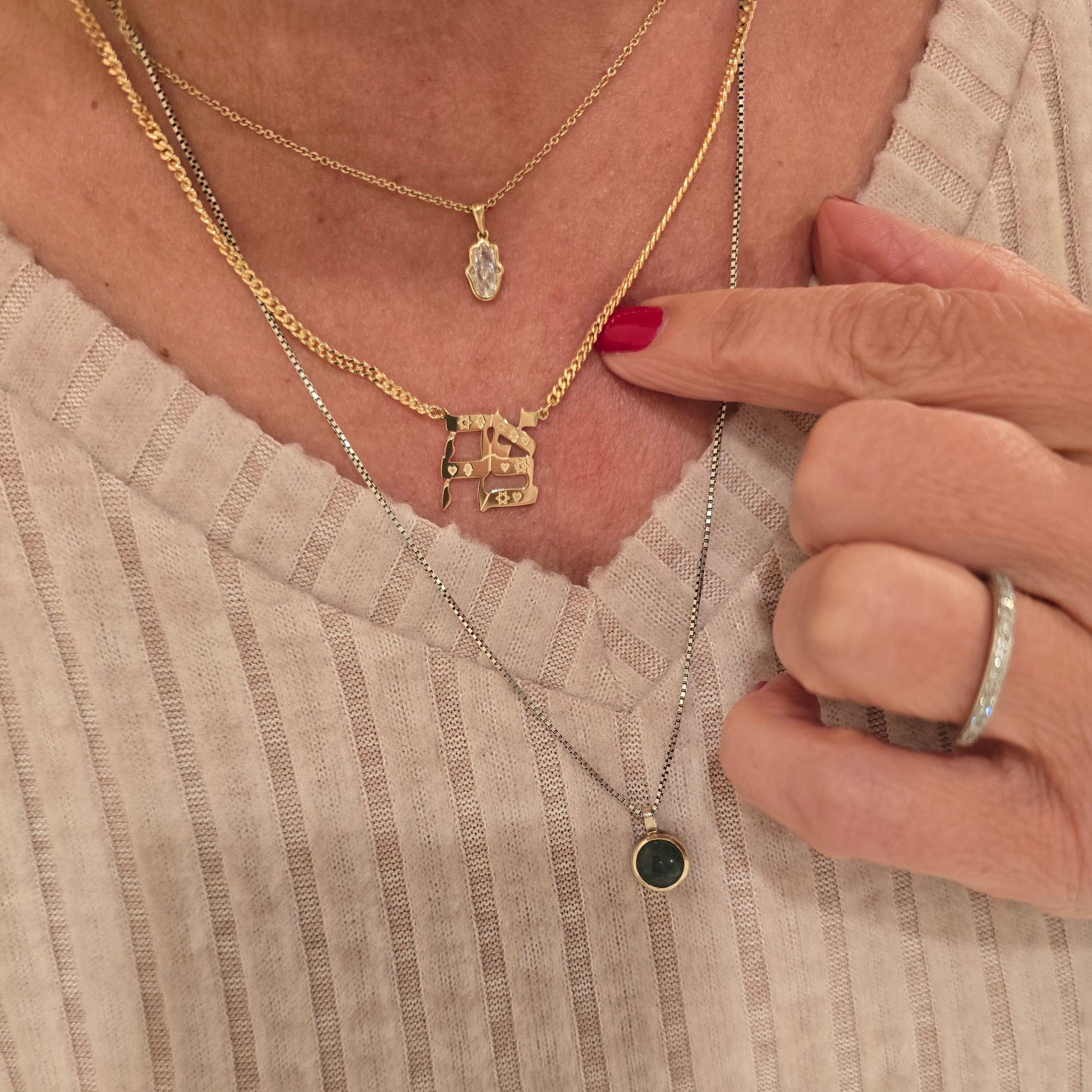 Gold plated Hebrew Ahava love necklace featuring hand-engraved symbol detail by Alef Bet