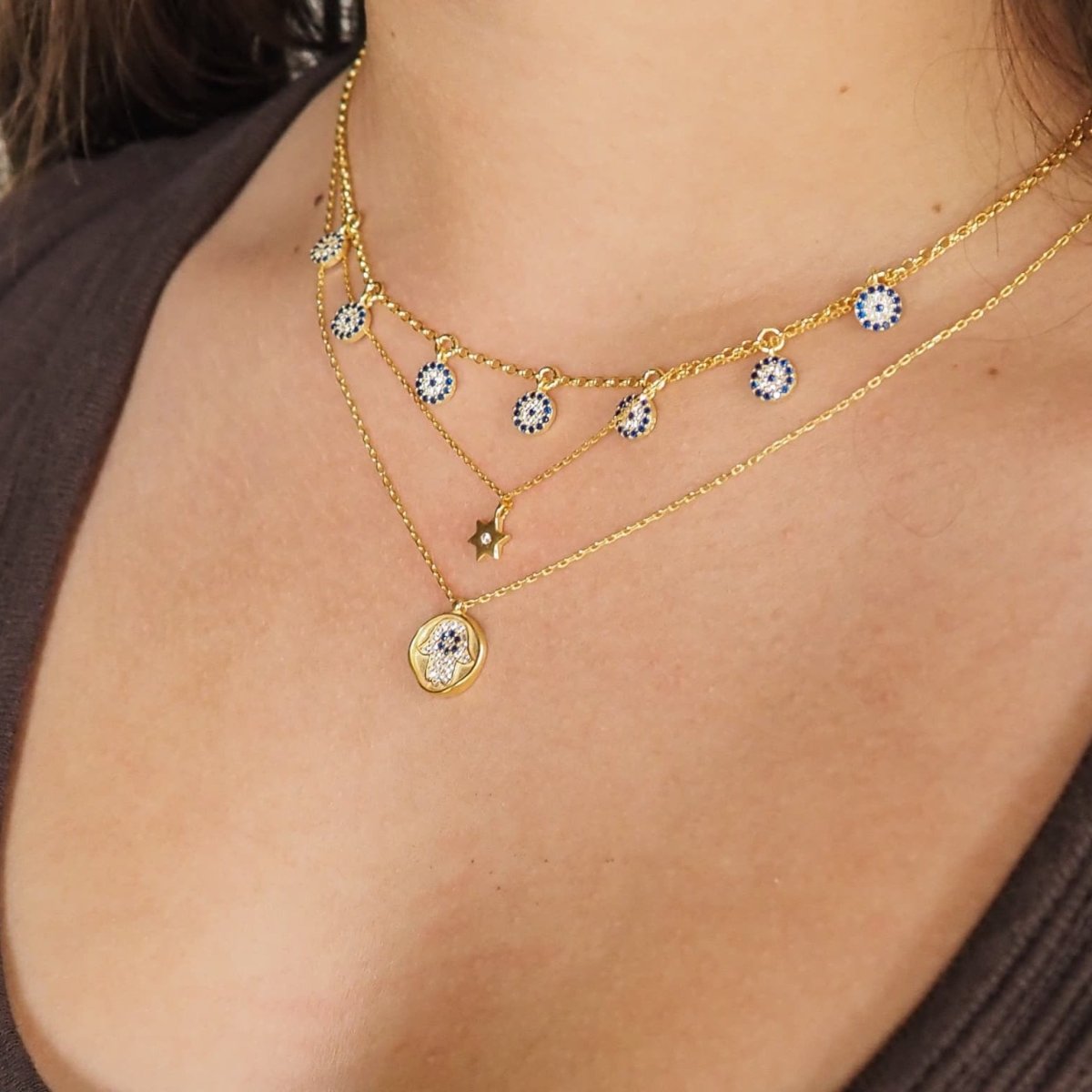 Golden Hamsa Necklace with an Evil Eye in the Center