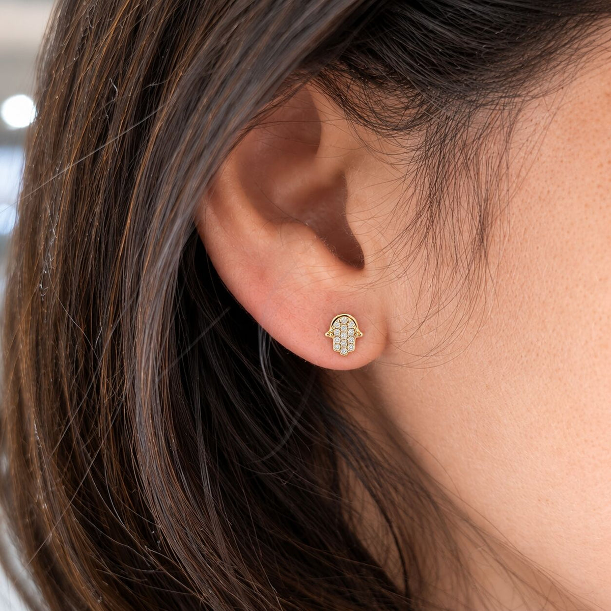 Hamsa earrings in 14k gold with bead-set diamond accents by Alef Bet