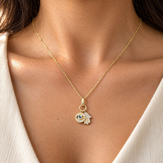 14K gold hamsa and evil eye necklace with pave diamond and sapphire accents by Alef Bet